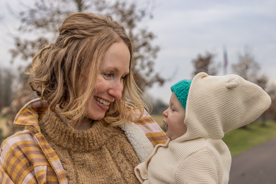 mom smiles at baby at Upland Farms
