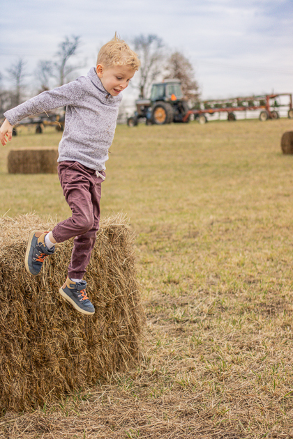 Jumping off Hay Bales during Chester County Photography Session