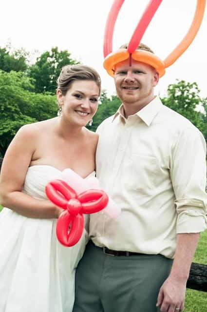 Josh and I on our wedding day with balloon flowers and hat, obviously.  I wish I could have had this photo printed!