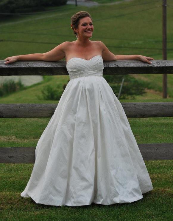 Me in my wedding dress, leaning against the fence and being all cool.